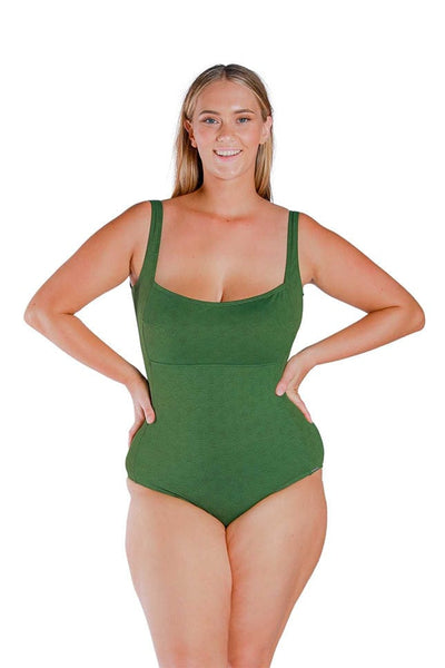 Model wearing olive green textured one piece swimsuit with square neckline