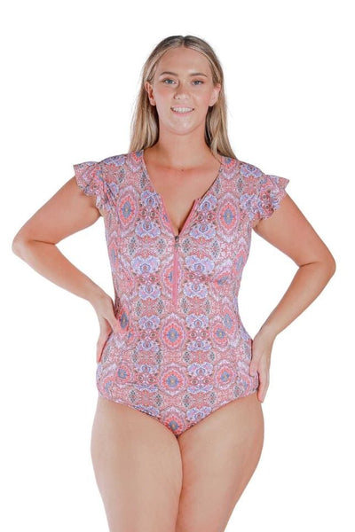 Front Shot of model wearing pink and red toned frilled sleeve one piece with zip front