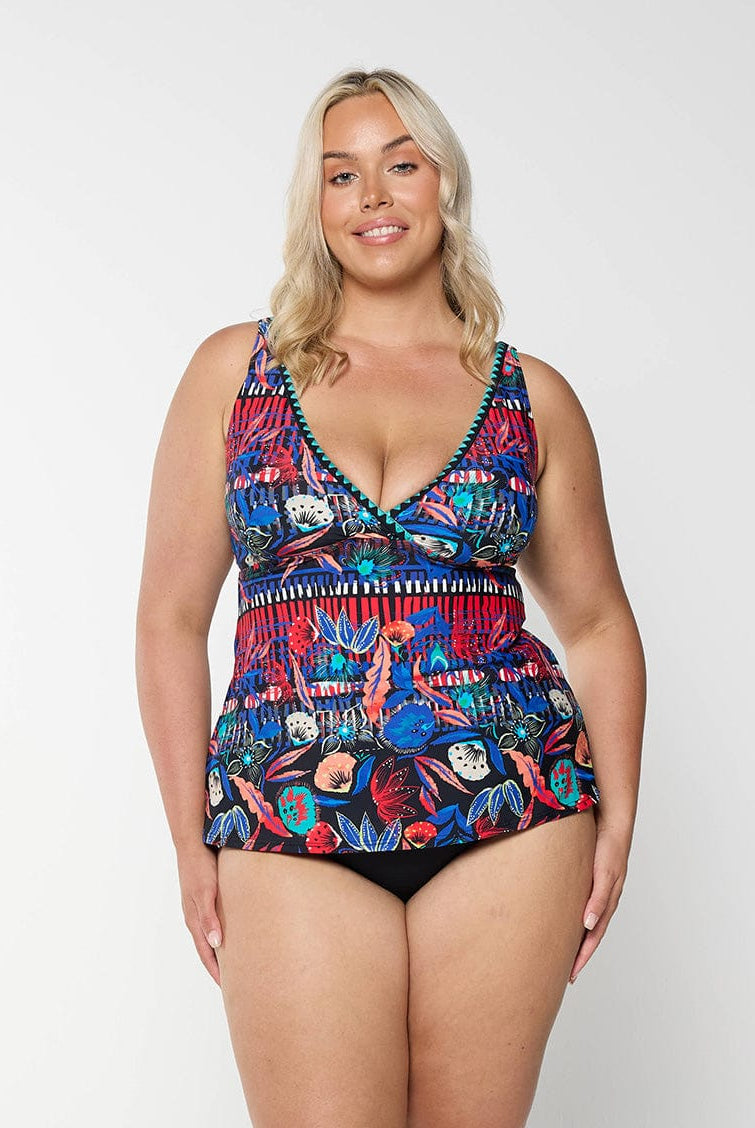 Front of curve model in studio wearing a multi coloured tankini top with v neckline