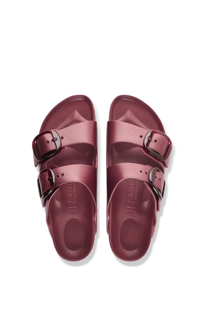 A pair of deep burgundy double-strap slide sandals with silver buckle details, shown from a top-down view on a white background.
