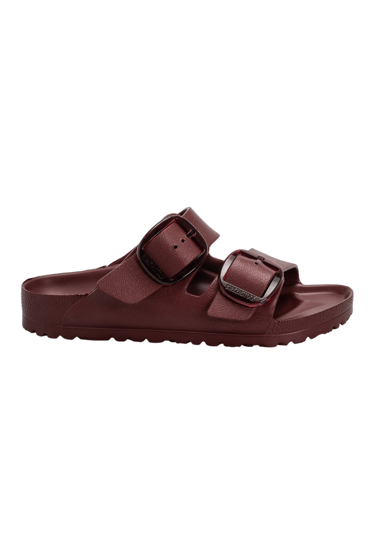 A single burgundy double-strap slide sandal with adjustable buckle straps, shown in profile against a plain white background.