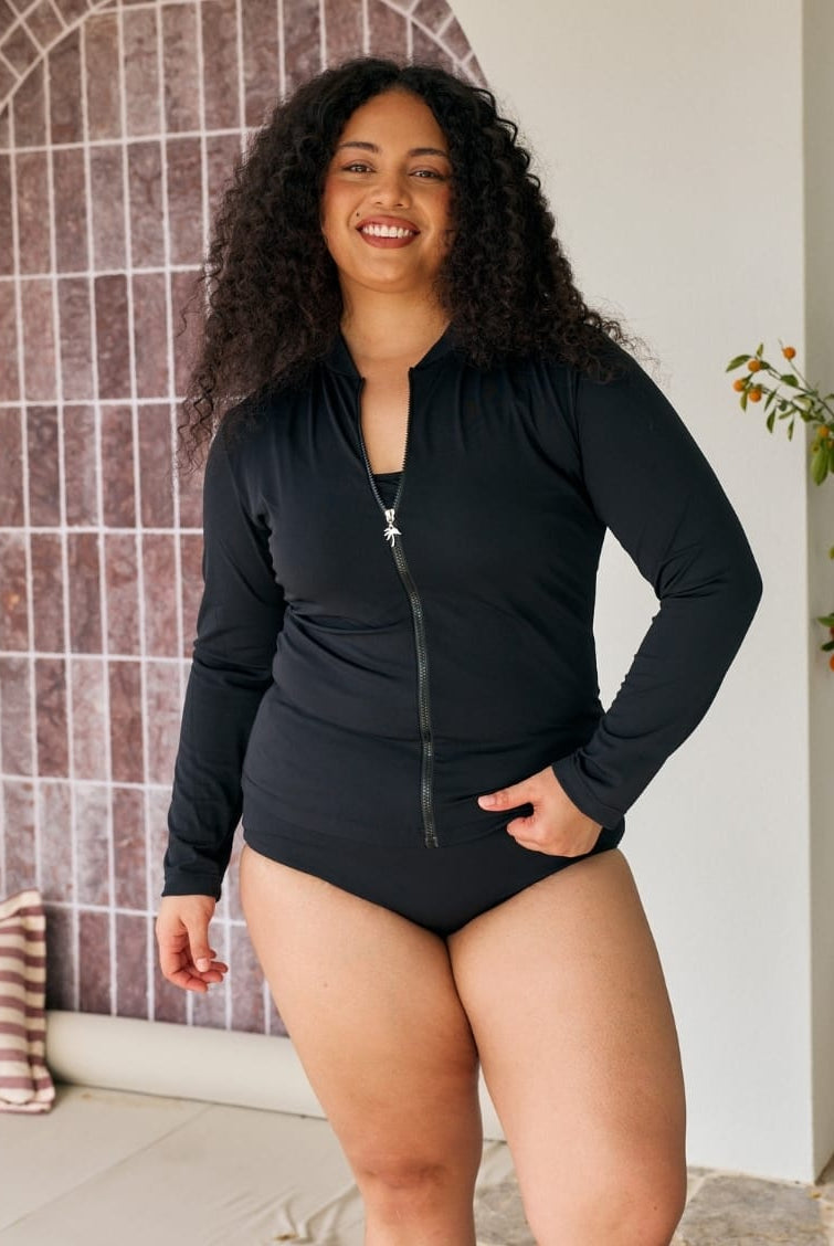 Model wears a long sleeve rashie with full zip detail