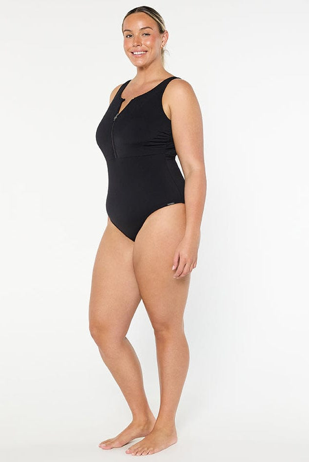 Woman wearing a black swimsuit on a white background
