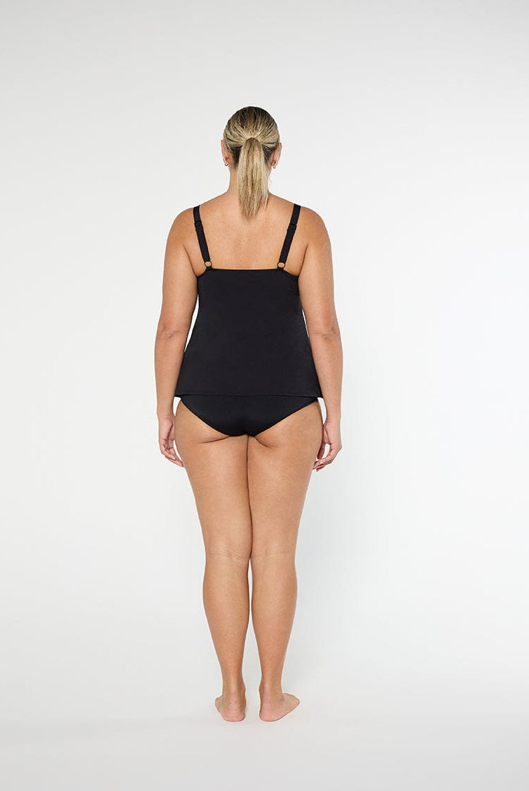 Person wearing a black swimsuit on a white background