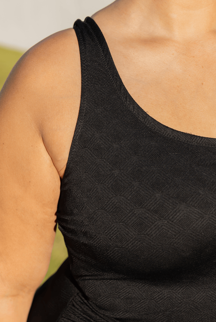 detailed image of one piece texture worn by a person with a blurred background
