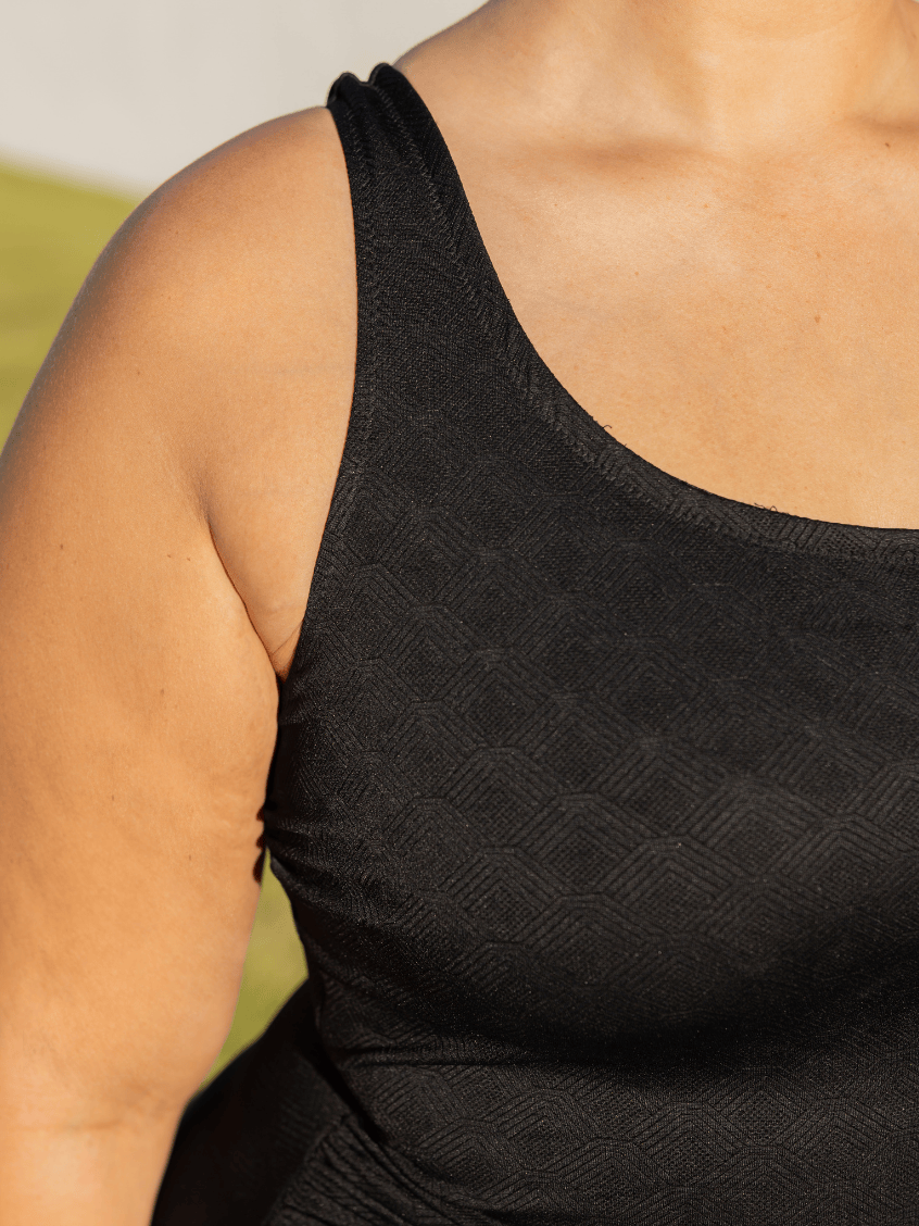 detailed image of one piece texture worn by a person with a blurred background