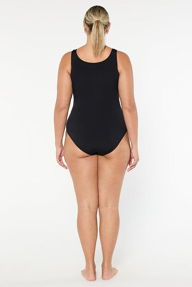 Person wearing a black swimsuit on a white background
