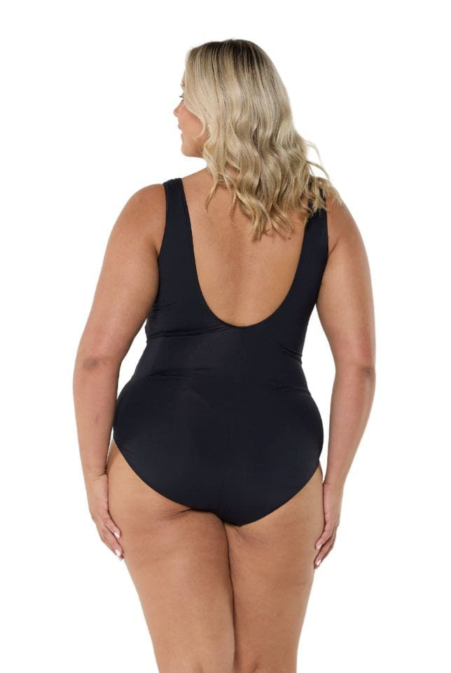 Model showing back of black and white square neck one piece