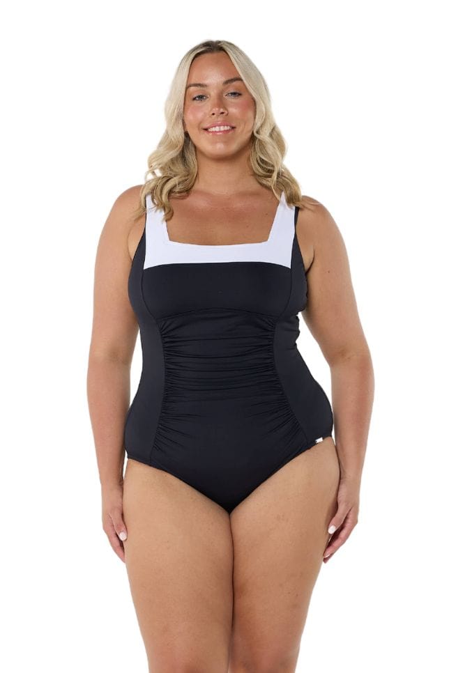 Model wearing black and white square neck one piece