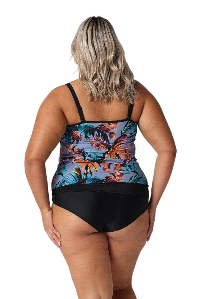 Back of plus size model in studio wearing flouncy bandeau in grey based floral print
