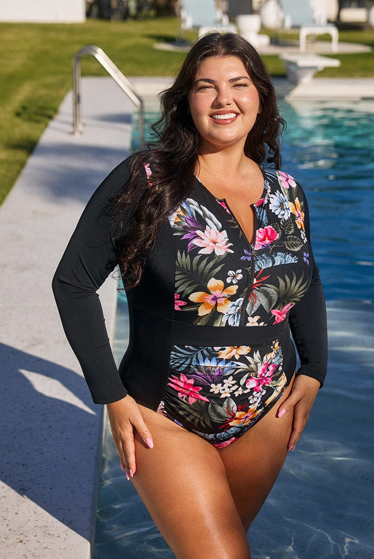Woman wearing a floral swimsuit by a pool