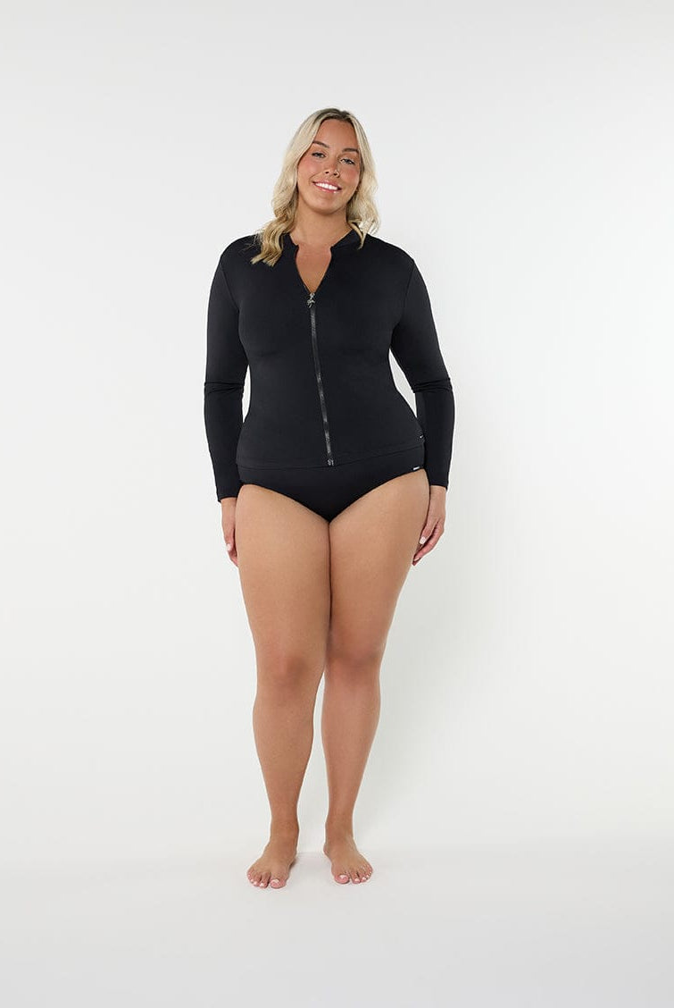Woman wearing a black zip-up swimsuit on a white background