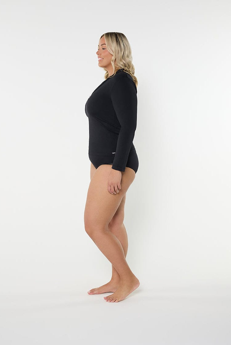 Woman wearing a black bodysuit on a white background