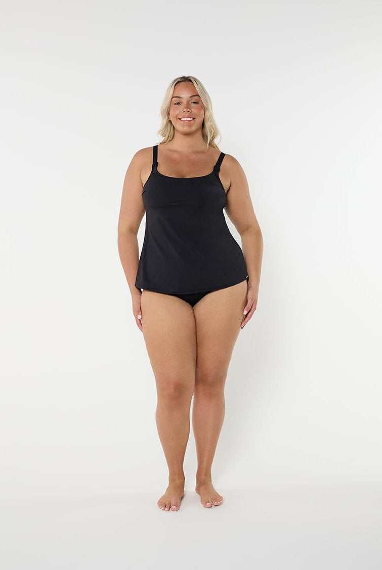 Woman wearing a black swimsuit on a white background