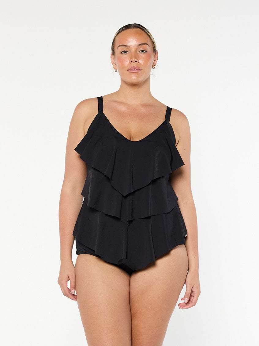 Blonde model wears 3 tier tankini top with chlorine resistant fabric