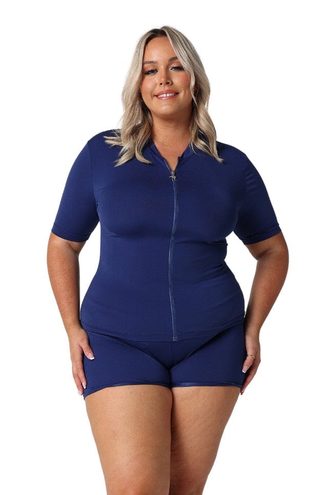 Blonde model wearing chlorine resistant navy rash vest and matching short