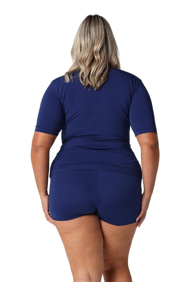 Blonde model showing back of navy short sleeve rash vest