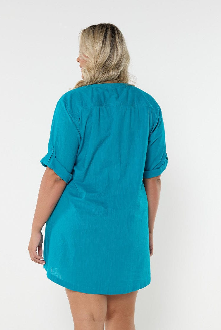 Blonde model showing back of ocean blue women's swimwear cover up dress