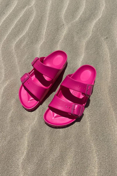 Women's pink slide on sandal on beach