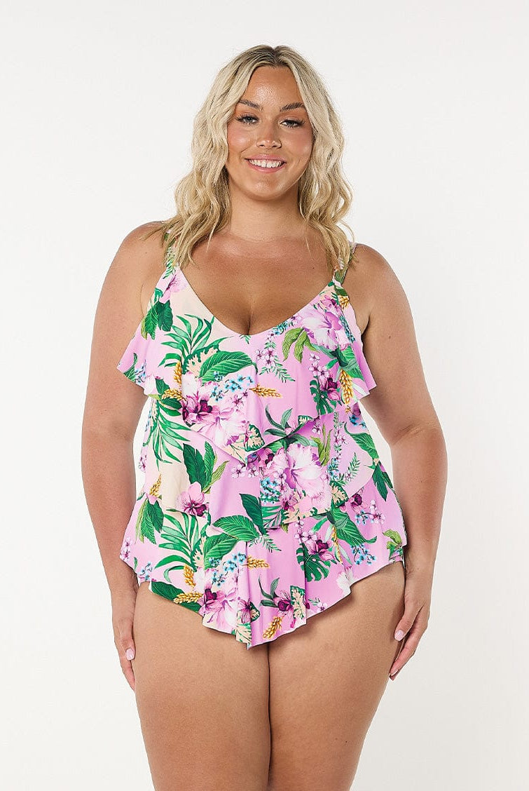 Woman wearing plus size tiered tankini top in pink floral