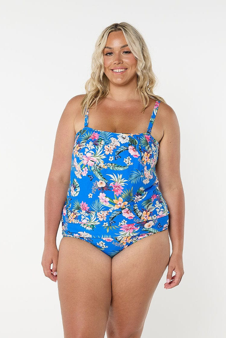 Blonde model shows front of floral blue bandeau top with removable straps