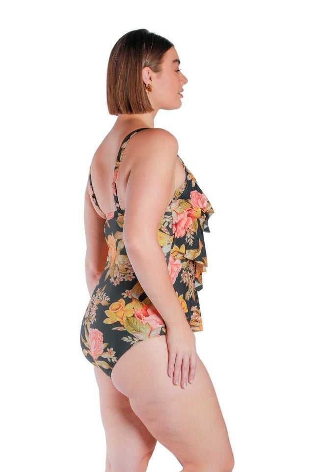 Plus size brunette model wearing a three tiered ruffled swimsuit in black based floral print Australia