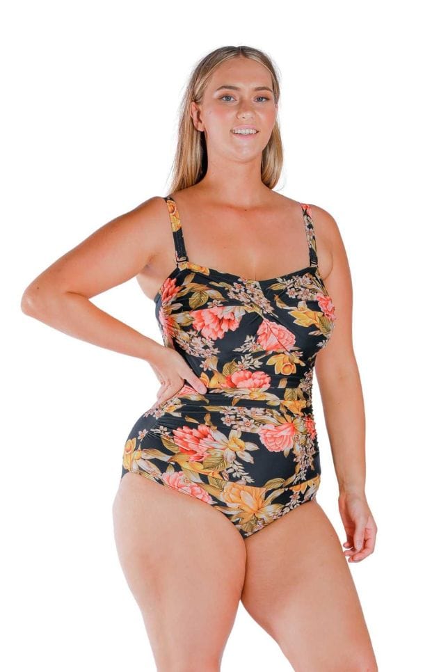 Blonde curve model wearing a flattering colourful floral one piece Australia