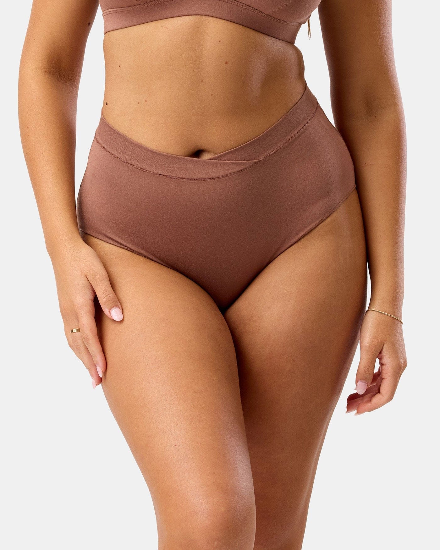Brown high-waisted bikini on a white background