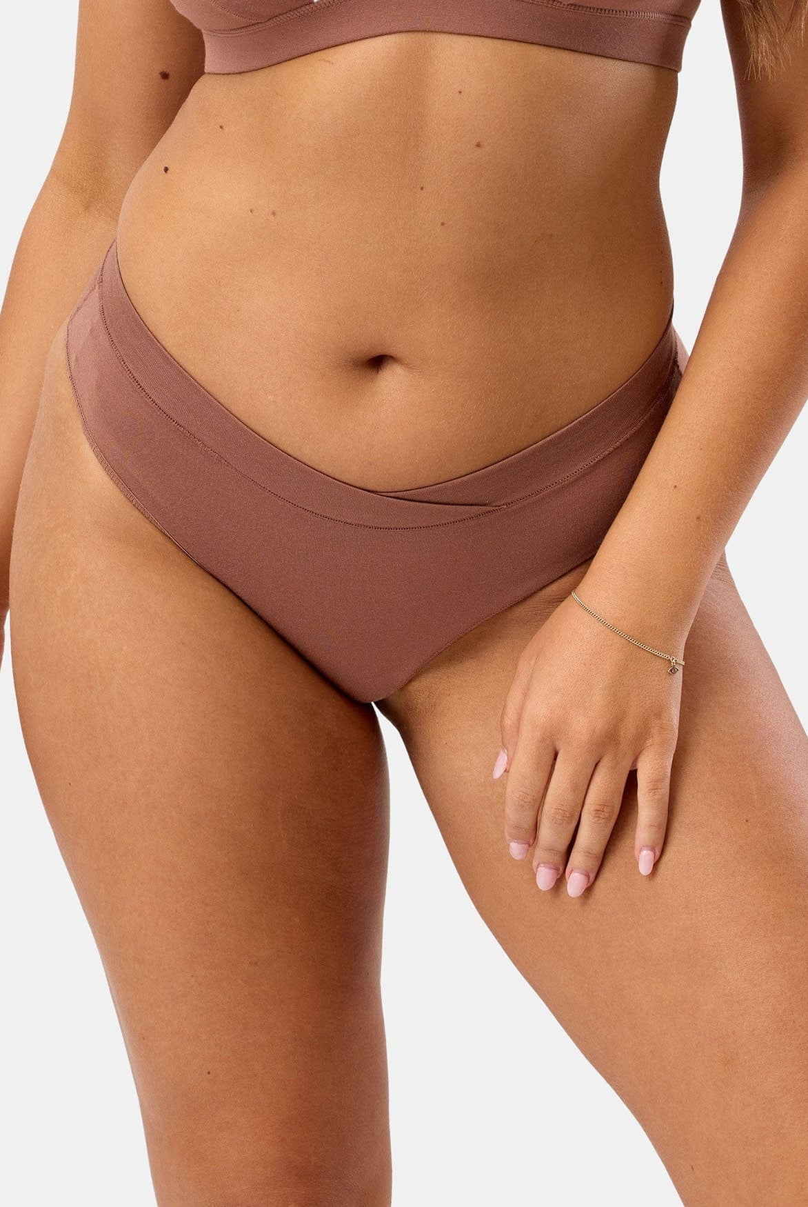 Brown underwear bottom worn by a person on a white background
