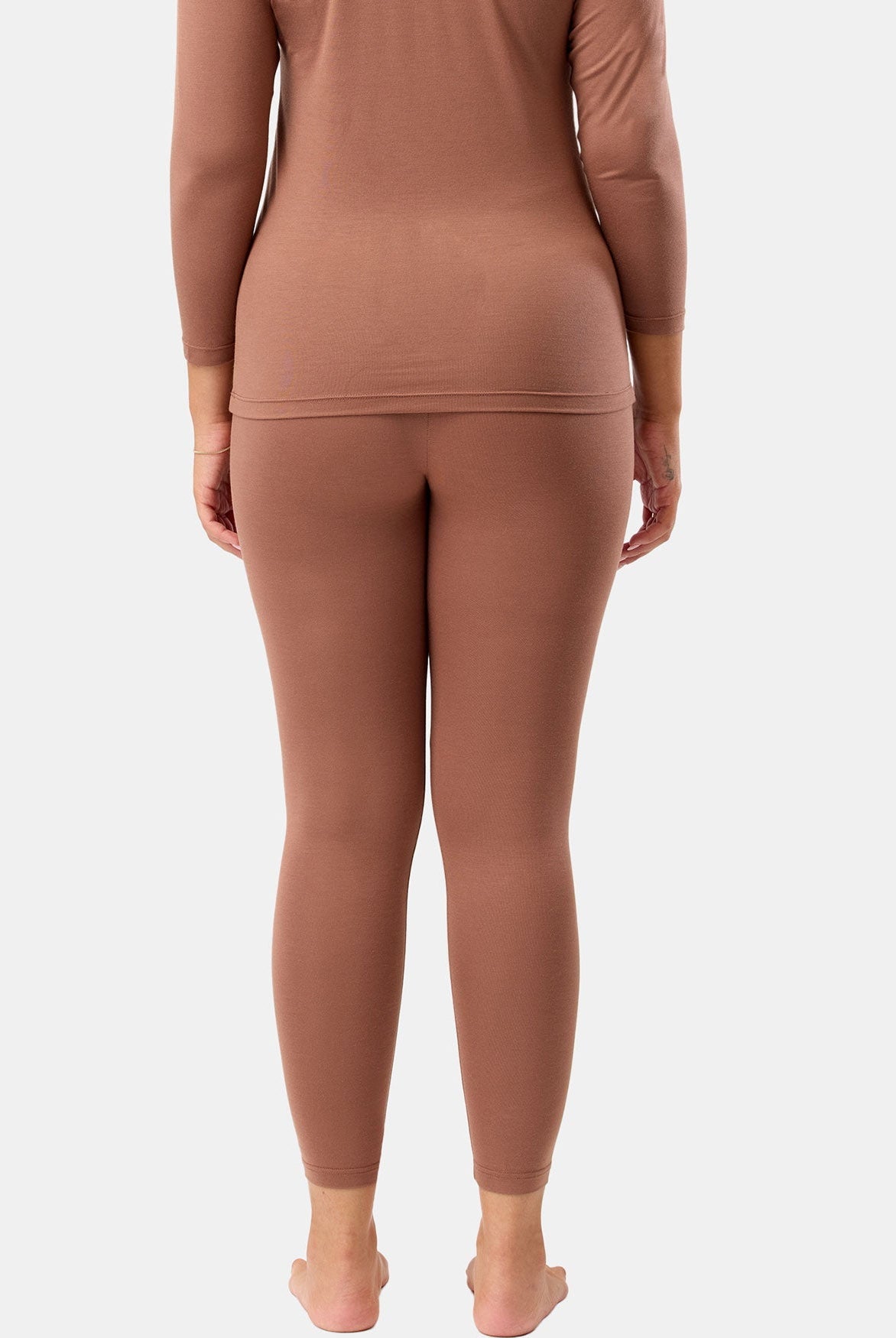 Brown long-sleeve top and leggings set on a white background