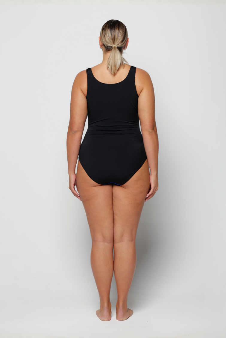Person wearing a black swimsuit on a white background