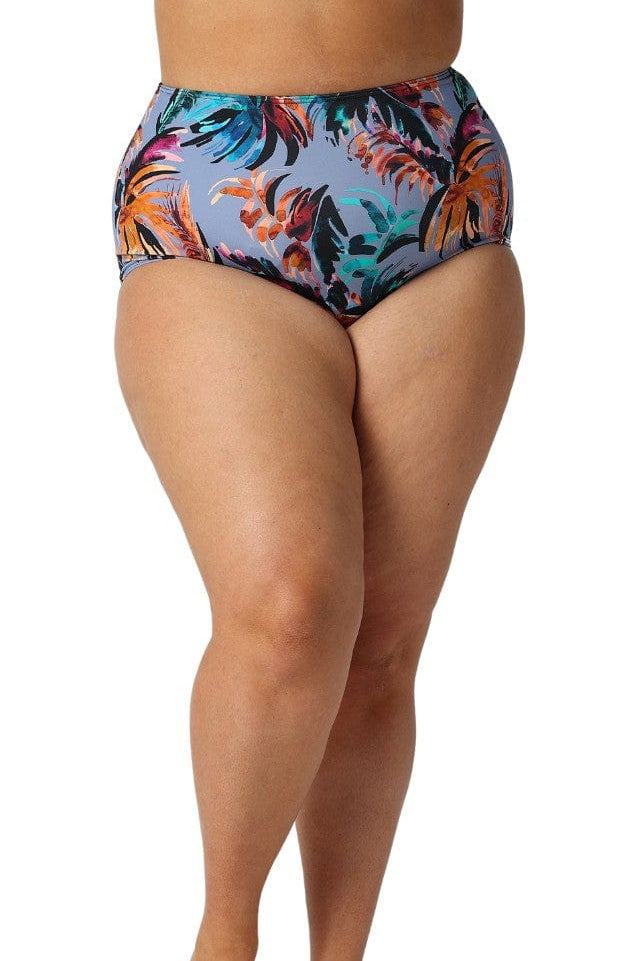 Curve model in studio wearing high waisted floral pant in grey blue