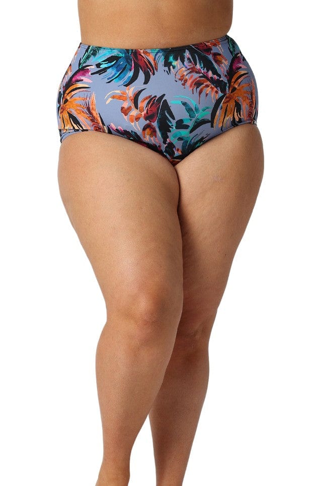 Curve model in studio wearing high waisted floral pant in grey blue