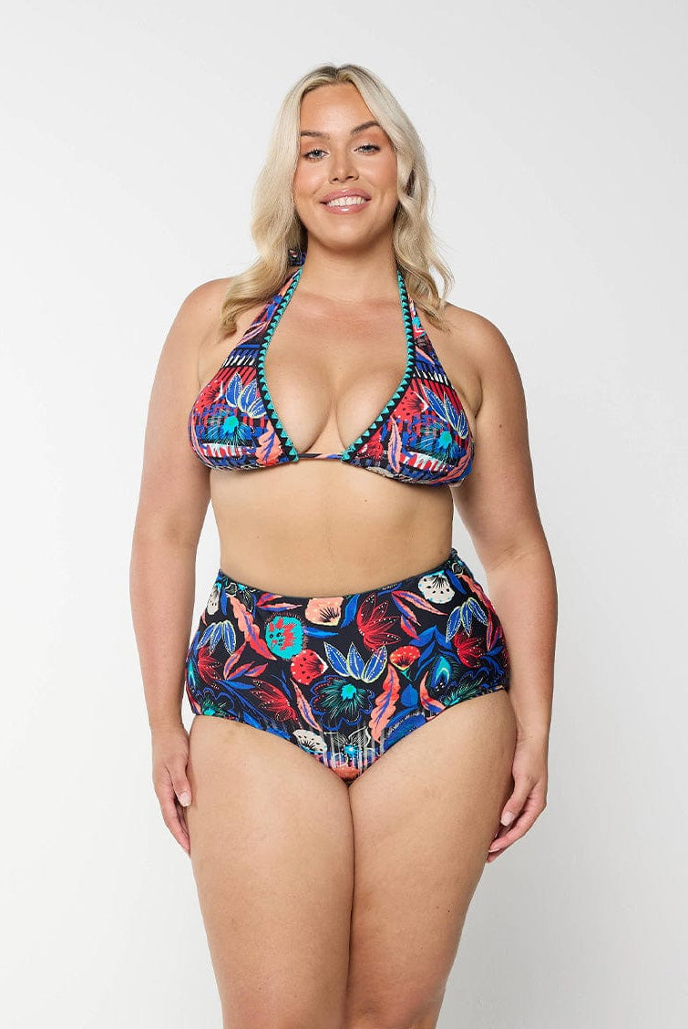 Blonde model in studio wearing high waisted multicoloured bikini bottom with floral print