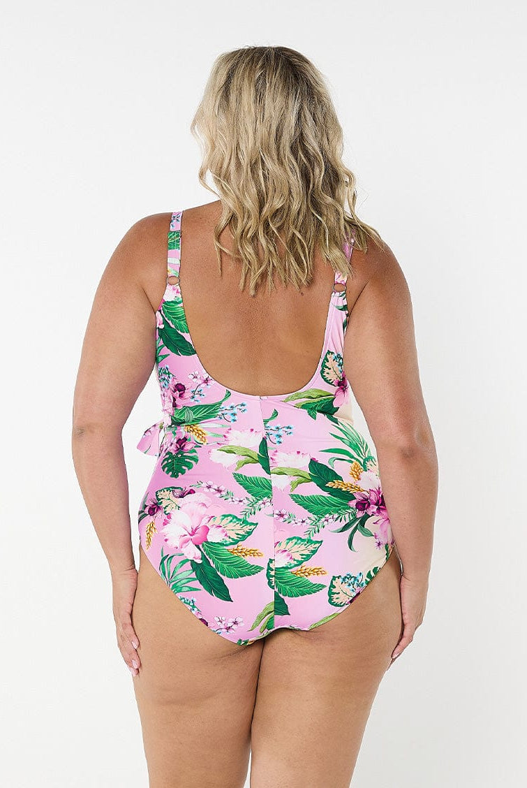 Blonde model in studio wearing plus size one piece with scoop back and adjustable straps