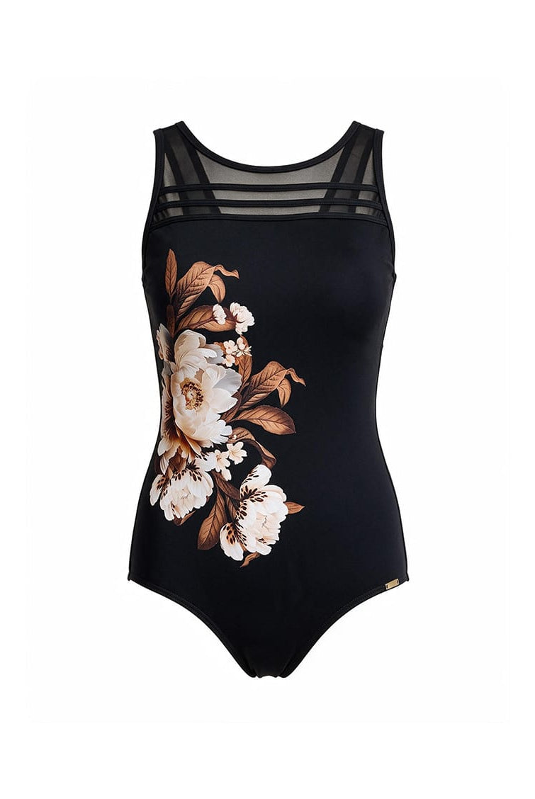 A black one-piece swimsuit featuring a large floral print in white, beige, and brown on the left side, with sheer black mesh shoulder straps, shown against a plain white background.