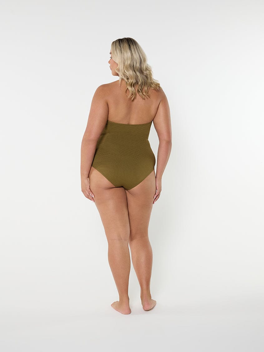 Person wearing a green swimsuit on a white background