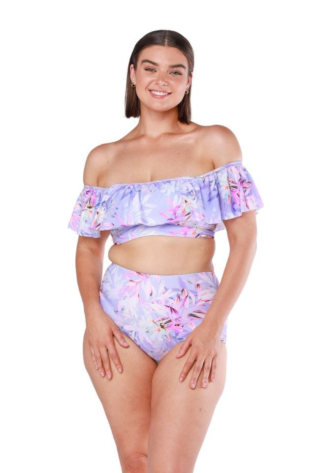 Brunette model wearing off the shoulder bikini top with ruffle detail in lilac