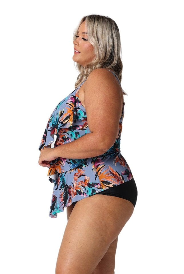 Side profile of model in studio wearing tankini top with ruffle detail in plus size