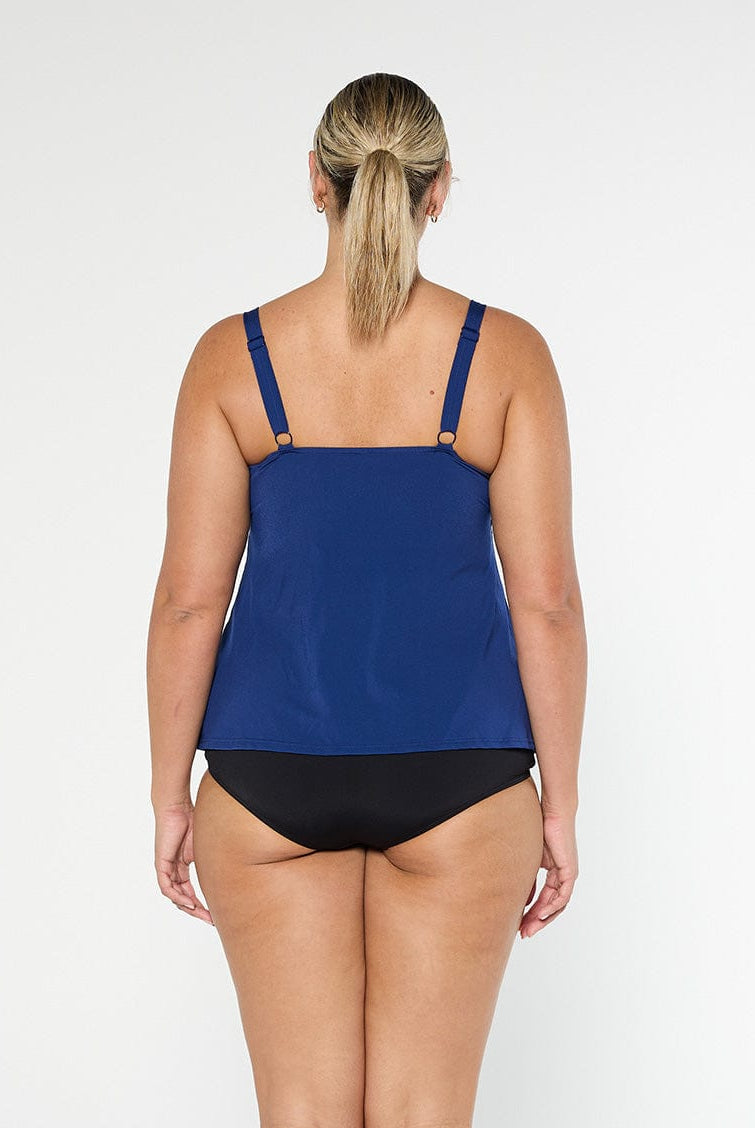 Back of model wearing a chlorine resistant tank tankini top in studio