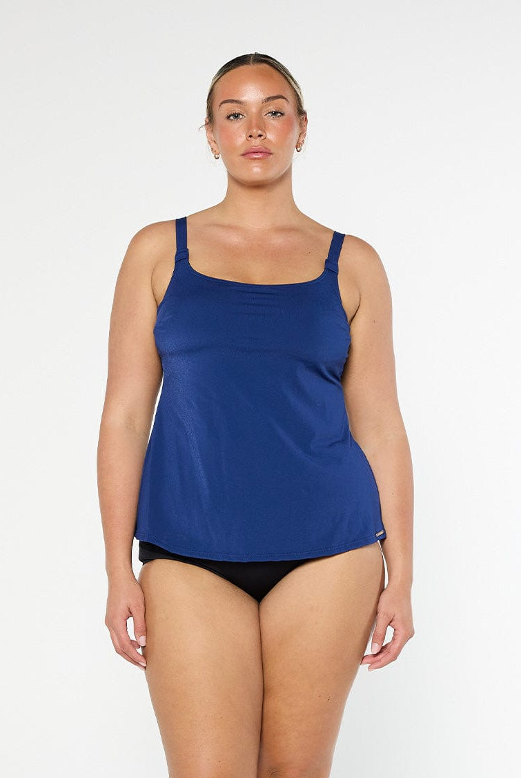 Woman wearing a blue tank top in chlorine resistant fabric