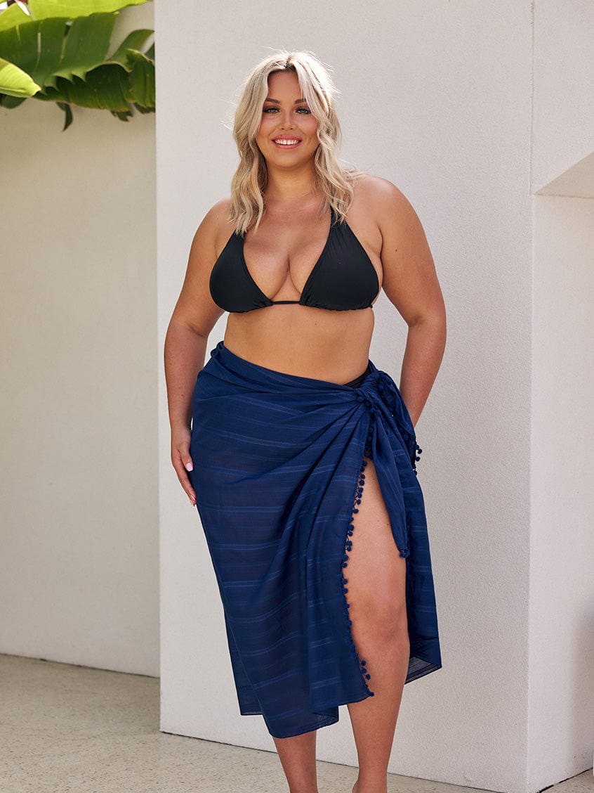 Blonde model wearing a long sarong in navy cotton