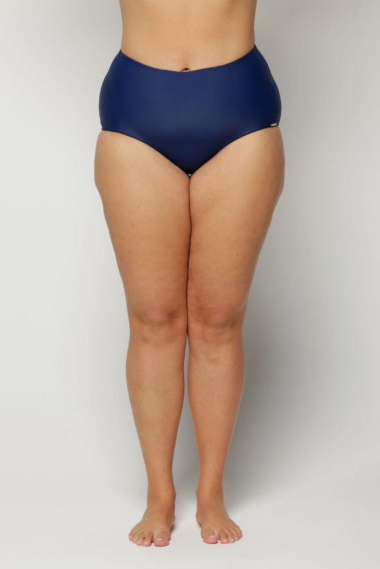 a woman wearing a Navy blue high-waisted swimsuit on a plain background