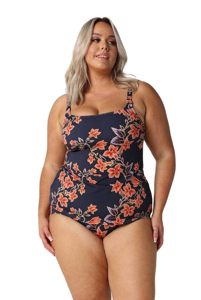 Front of model in studio wearing plus size tummy control high waisted pant in floral print