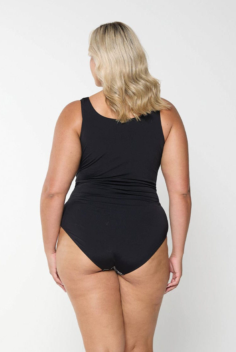 Back of model wearing high back one piece with zip front detail in paisley chlorine resistant