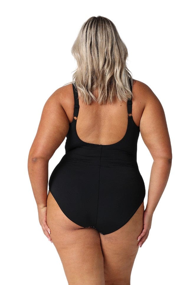 Back of model wearing plus size floral printed swimsuit with scoop back and adjustable straps