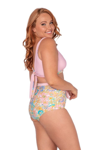Plus size model wearing multi coloured high waisted swim pants Australia