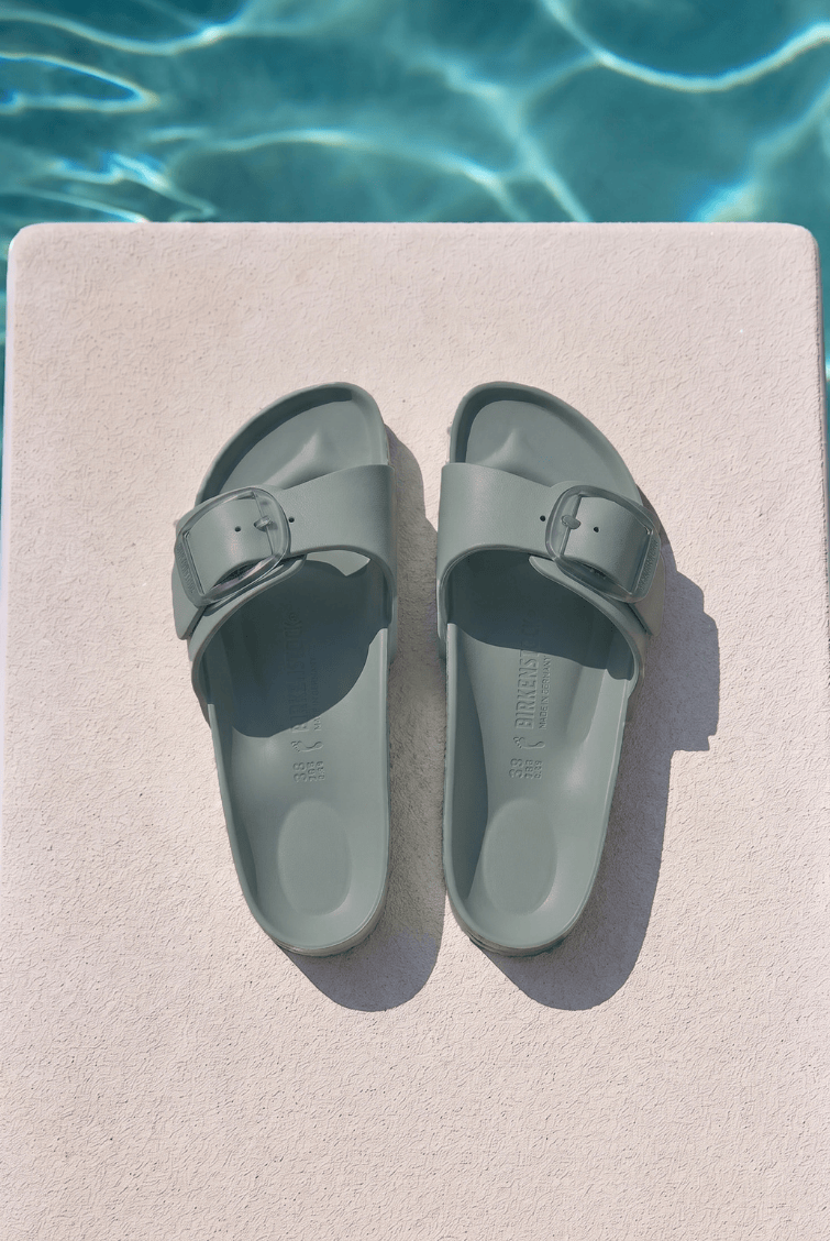 Sage birkenstock by pool with one strap