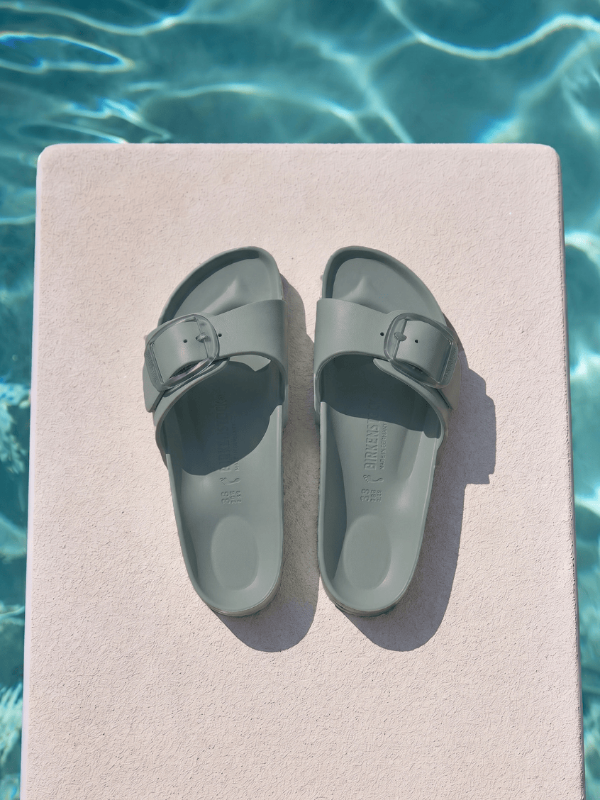 Sage birkenstock by pool with one strap