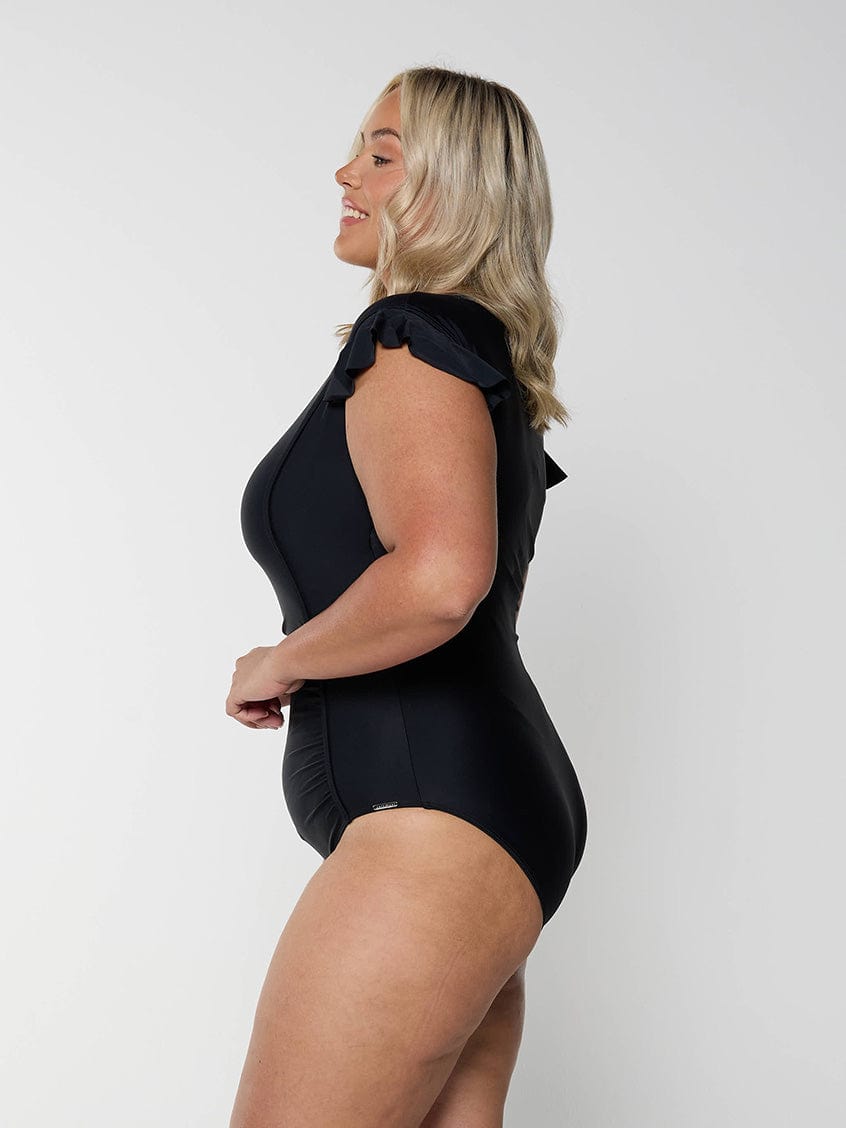 Blonde model wearing black frill sleeve full coverage womens swimsuit